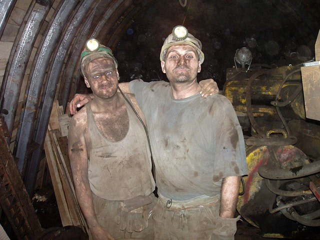 Miners emerging from a mine