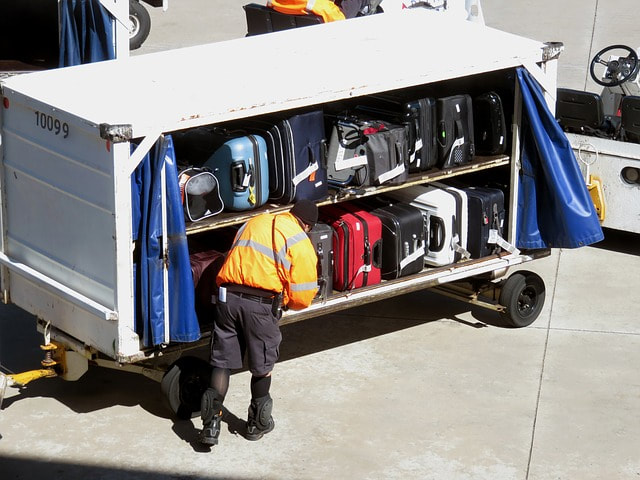 man handling baggage