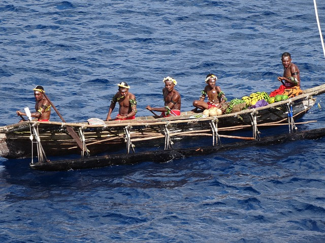 A party entering a large canoe