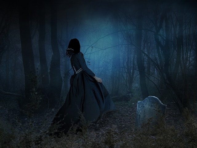 a widow at an open grave