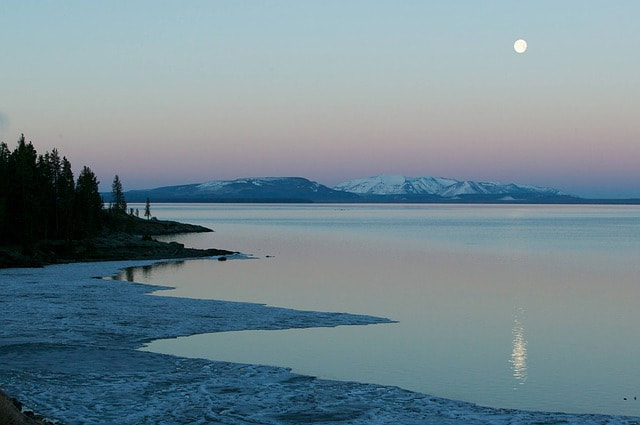 The Moon shining across a lake